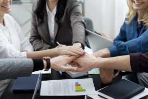 close-up-people-working-as-team-scaled.jpg